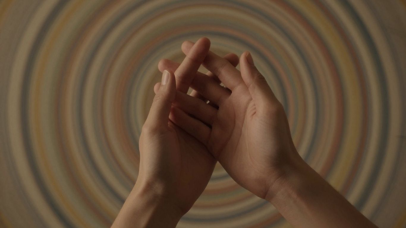 Two hands connecting, symbolizing synergy in healing.