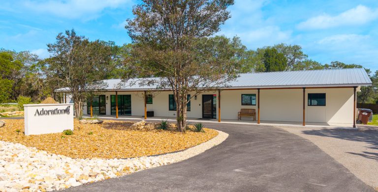 Aerial view of the Adoration office and sign in New Braunfels, TX