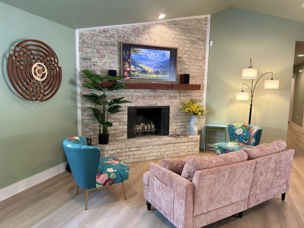 Adoration lounge with fireplace and comfortable seating
