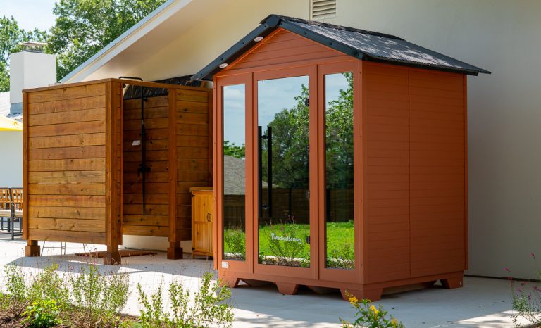 Outdoor cedar infrared sauna and shower at Adoration