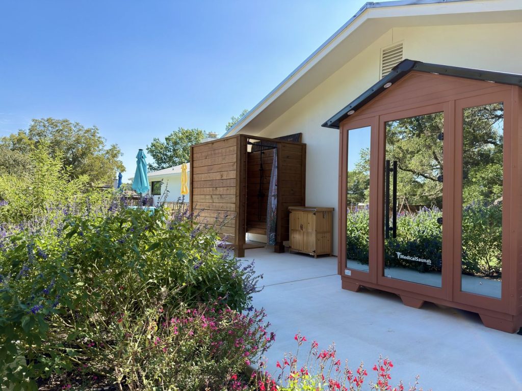 Outdoor cedar infrared sauna and outdoor shower at Adoration