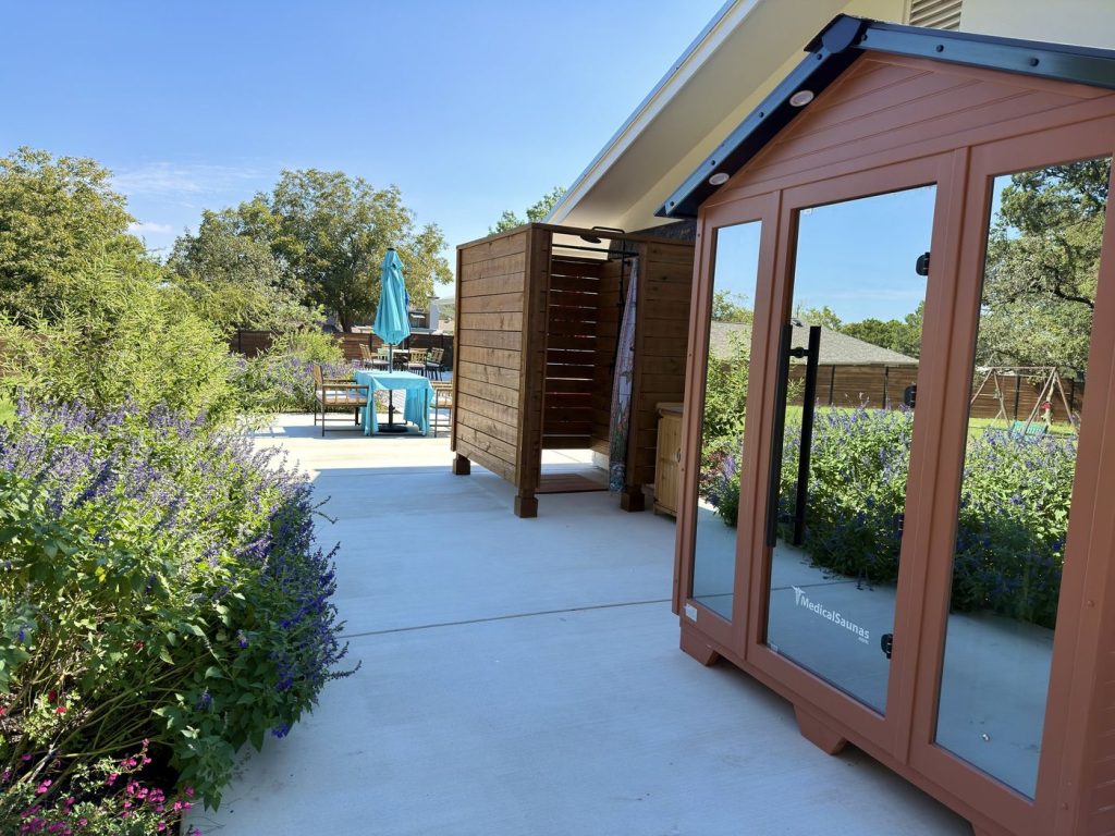 Outdoor infrared sauna, shower and garden at Adoration