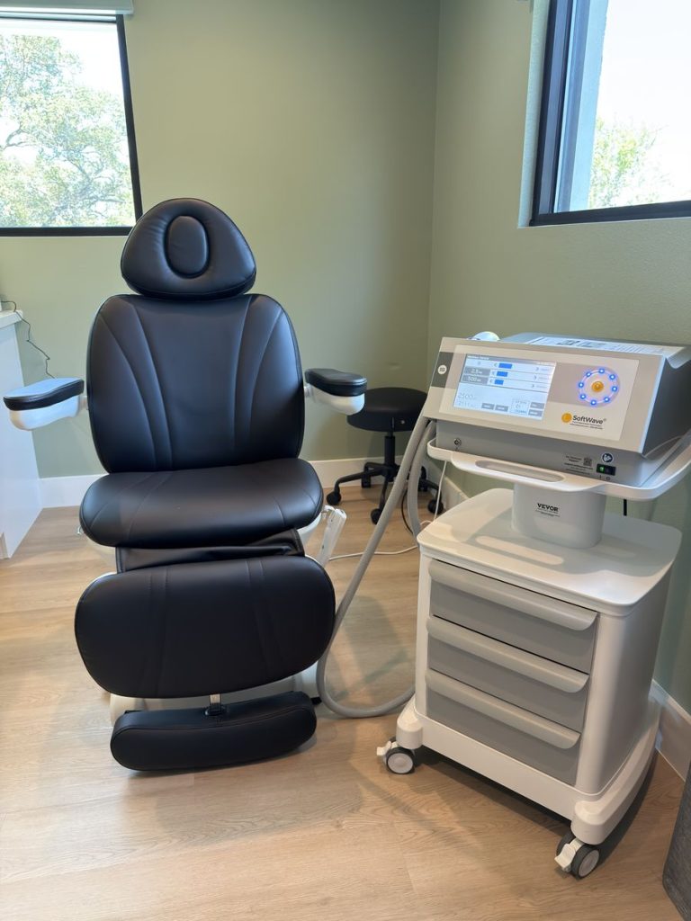SoftWave treatment room at Adoration with a treatment chair and device